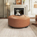 Pouffe rond capitonné en similicuir